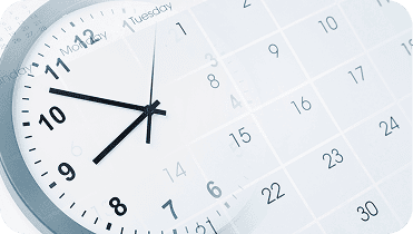 Clock showing 10:10 with a calendar in the background, representing time management and scheduling for website creation.