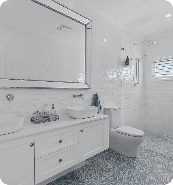 Modern bathroom with white subway tiles, dual vessel sinks, large mirror, toilet, and walk-in shower with window, stylish and clean design.